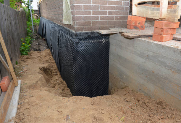 SJ Waterproofing Pros technician performing targeted Waterproofing assessment in Owensville, OH